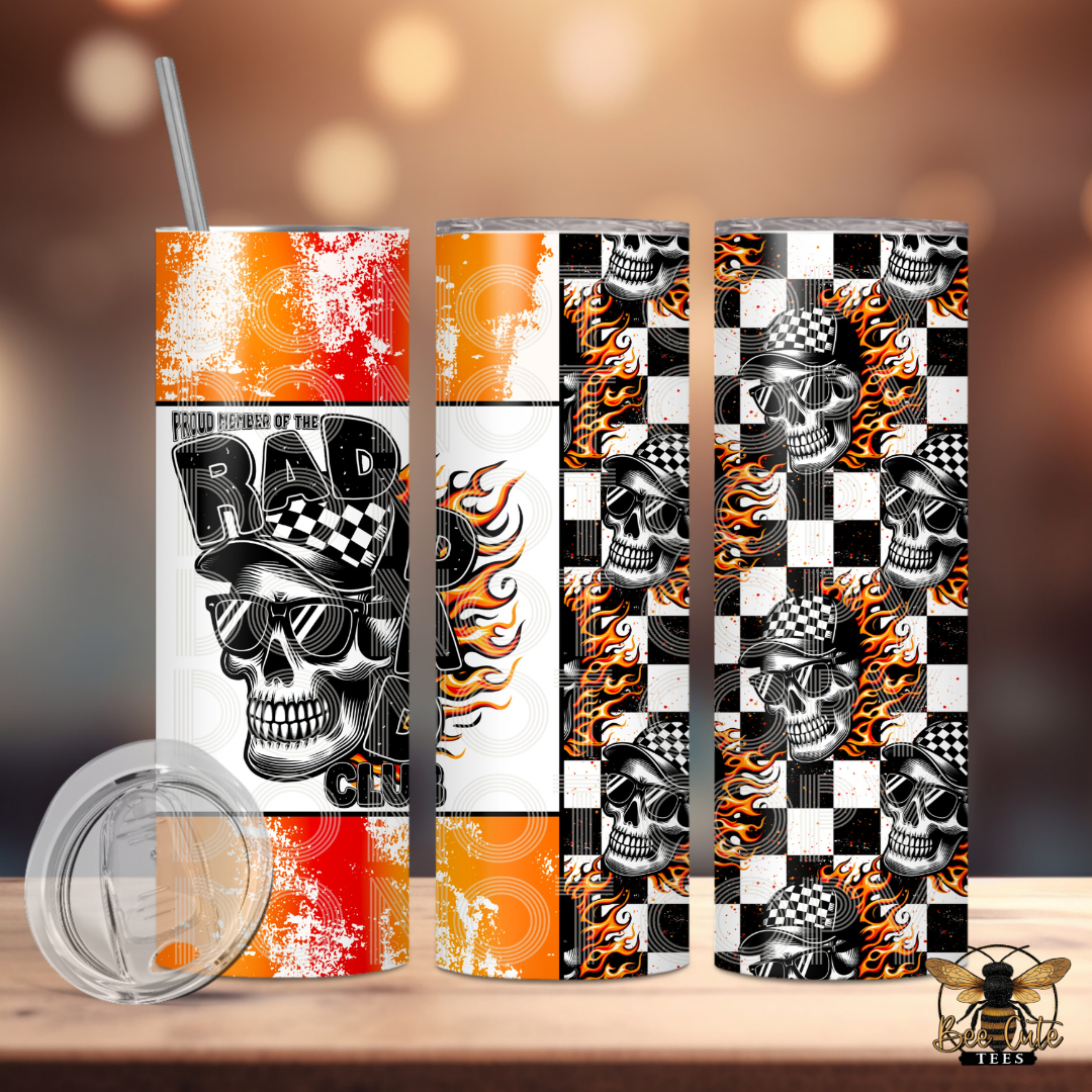 Skateboard with skull design and checkered pattern on a wooden surface.