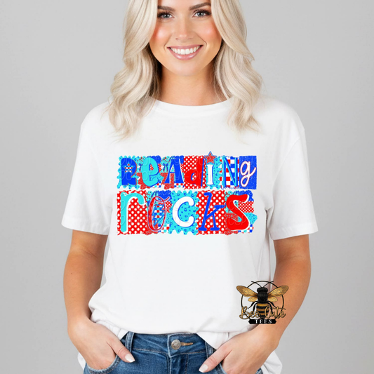 Person wearing a white t-shirt with 'Reading Rocks' design on a gray background
