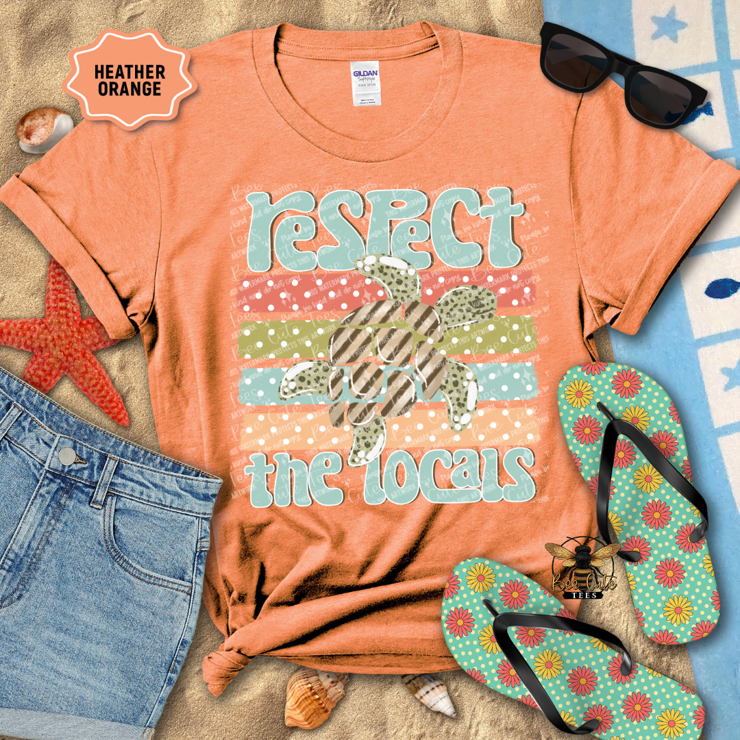 Orange t-shirt with 'Respect the Locals' graphic, sunglasses, starfish, and flip-flops on a beach-themed background.