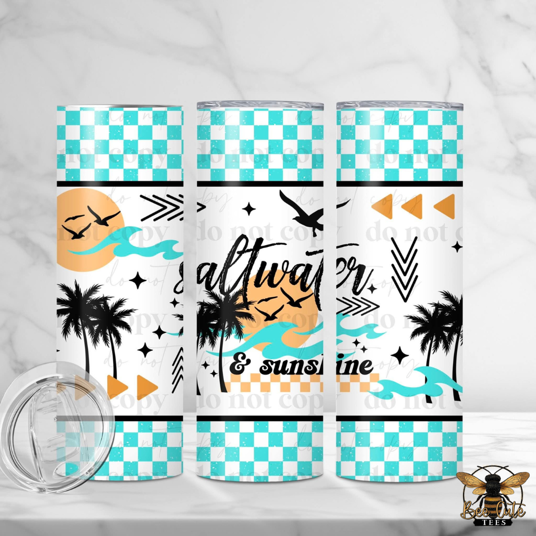 Three tumblers with tropical designs and checkered patterns on a white background.