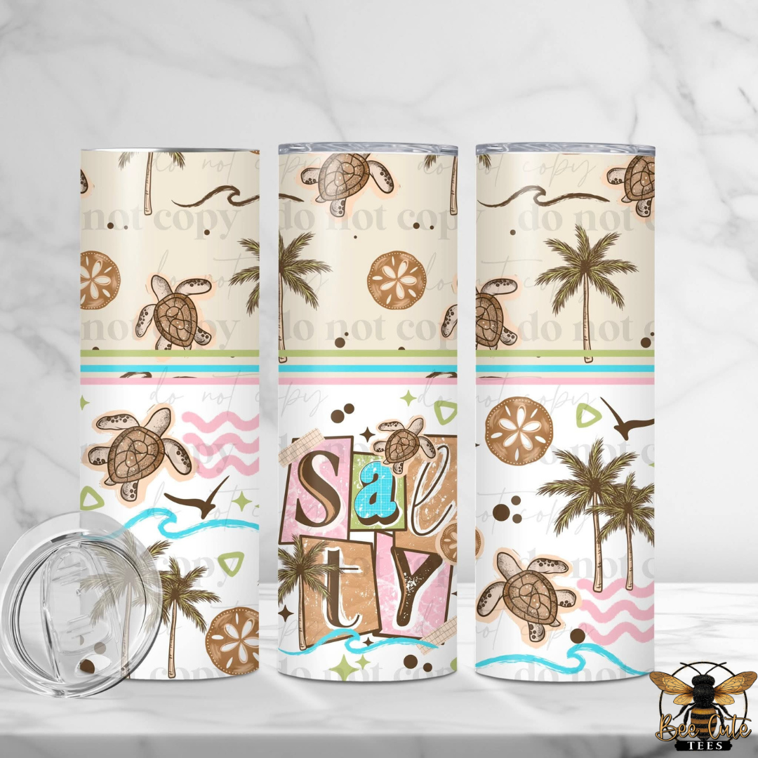 Three tumblers with beach-themed designs featuring turtles, palm trees, and sand dollars on a white background.