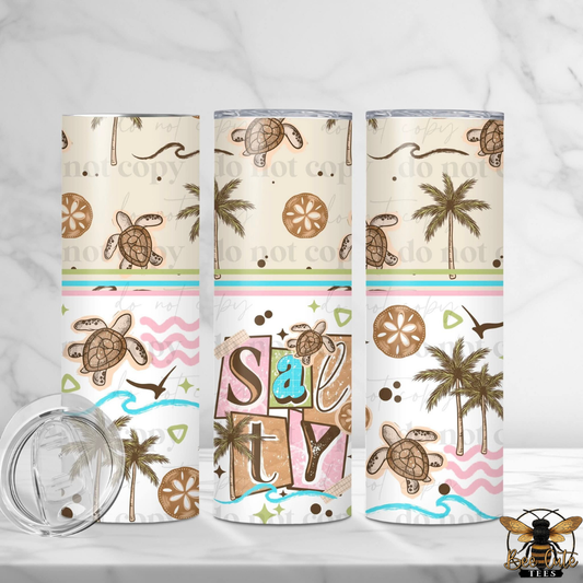 Three tumblers with beach-themed designs featuring turtles, palm trees, and sand dollars on a white background.