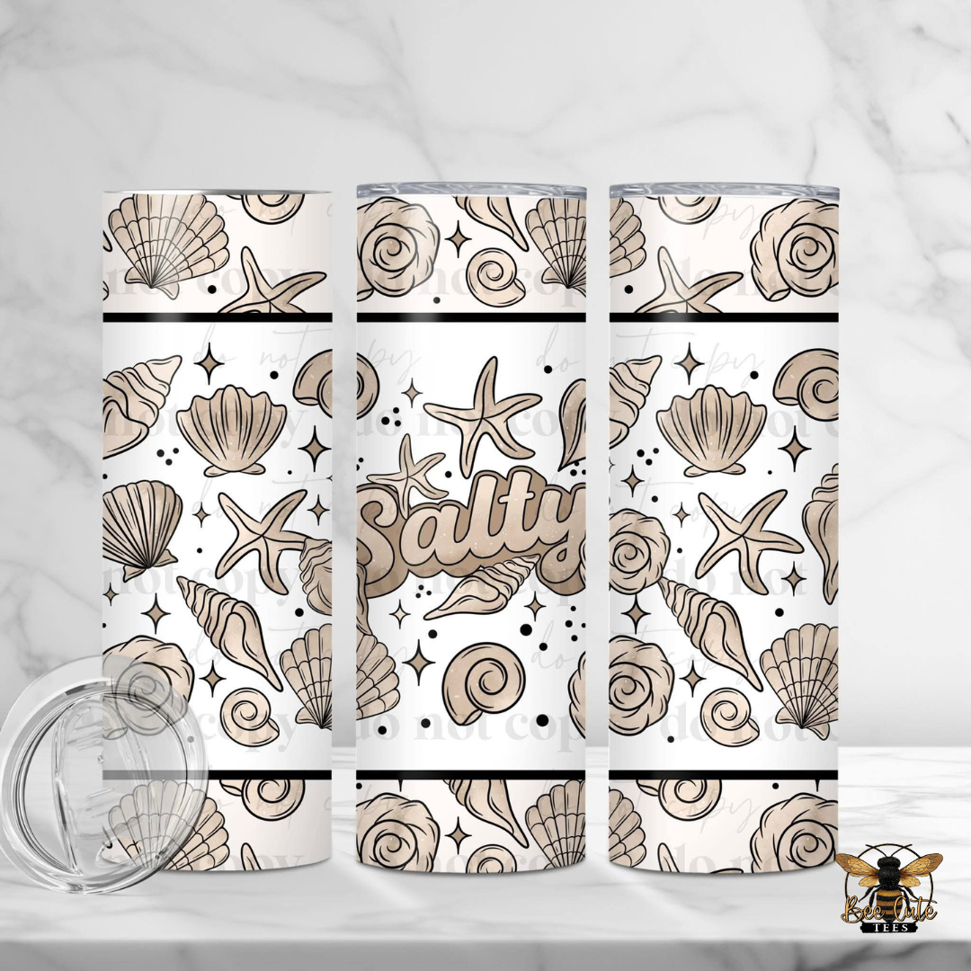 Set of three tumblers with seashell and starfish pattern on a white background