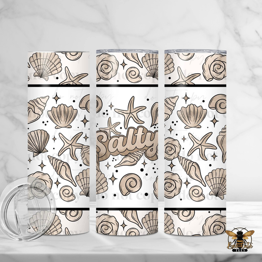 Set of three tumblers with seashell and starfish pattern on a white background