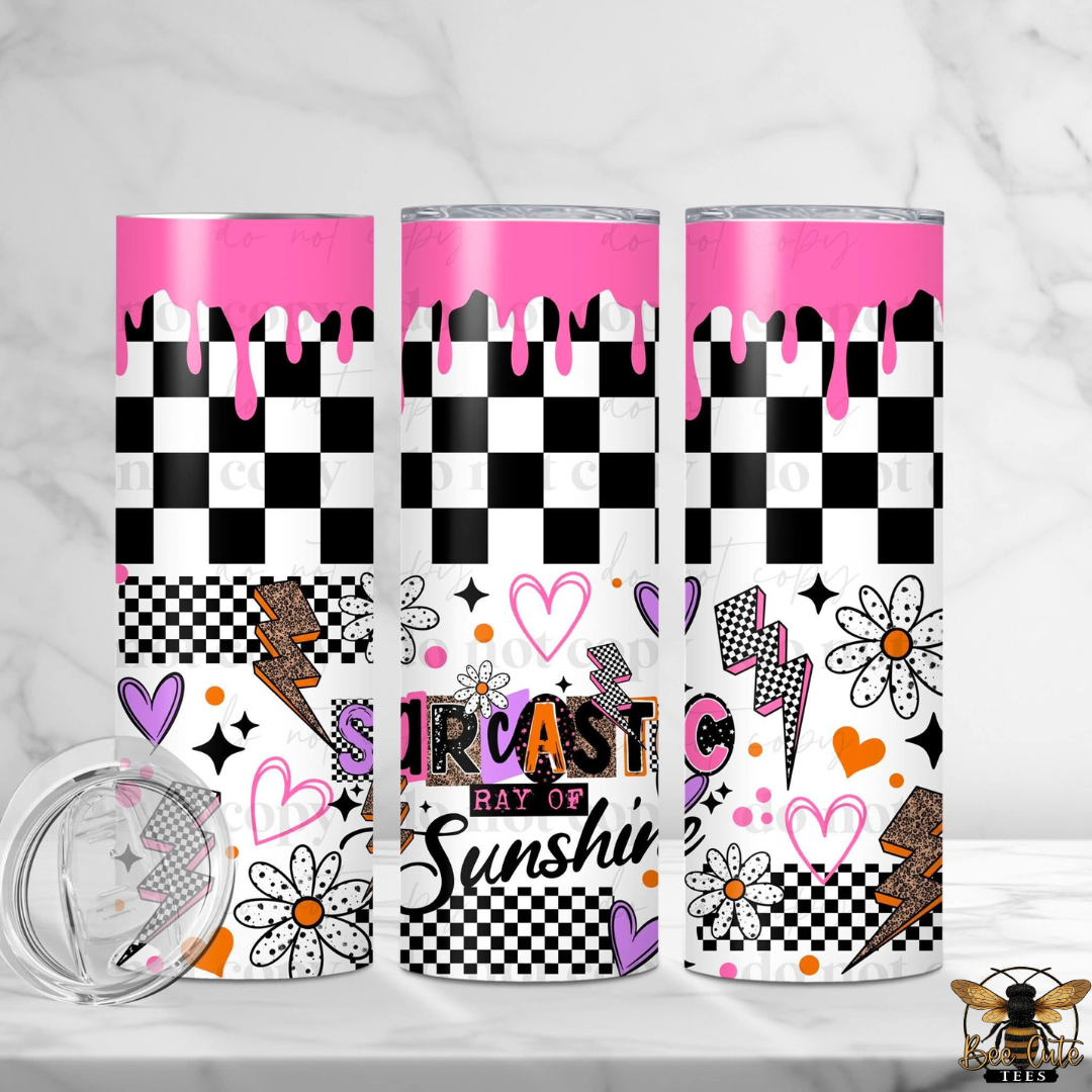 Three tumblers with colorful designs on a white background