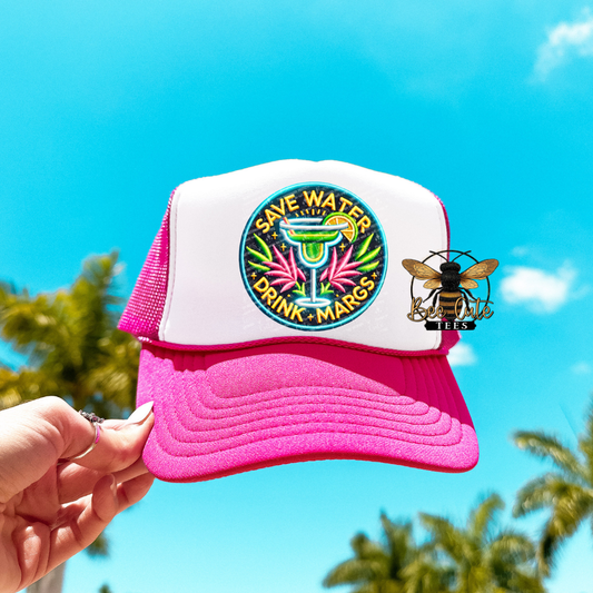 Pink and white cap with 'Save Water, Drink Margaritas' design against a blue sky.