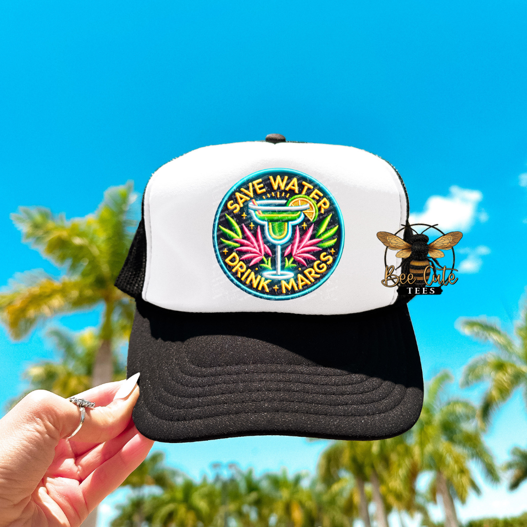 Trucker hat with colorful logo and text against a blue sky and palm tree background