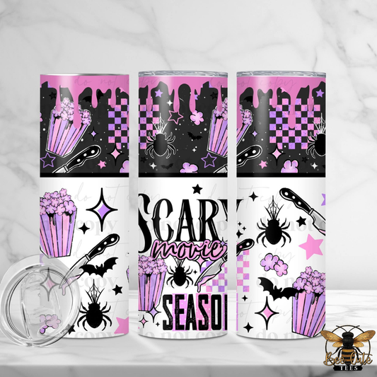 Three tall skinny tumblers with a pink and black Halloween-themed design, including silhouettes of a haunted house, stars, bats, and popcorn. The bottom wraps feature the text 'SCARY movies SEASON!'.