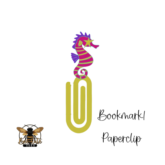 Colorful seahorse-shaped paperclip with a bee logo and text on a white background