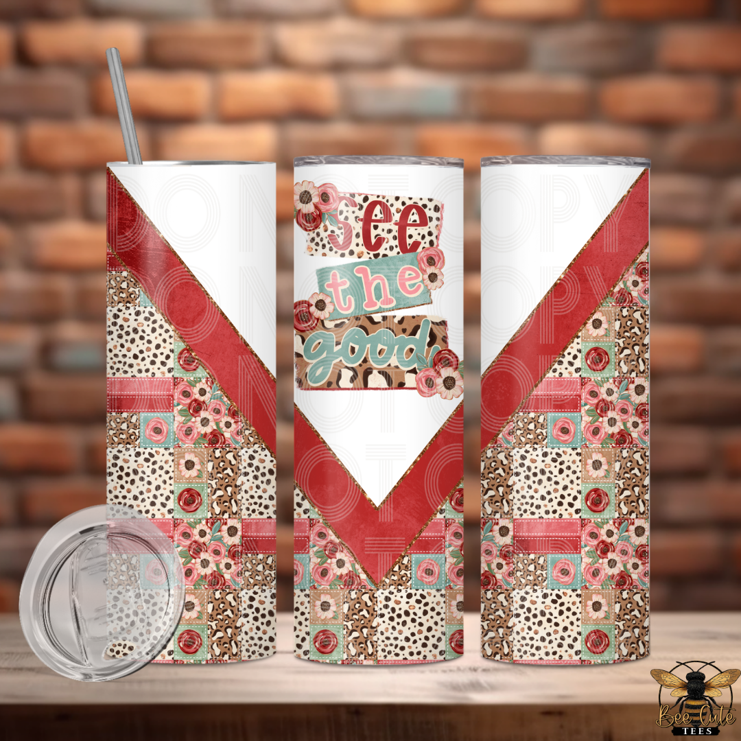 Tumbler with floral and patterned design against a brick wall background