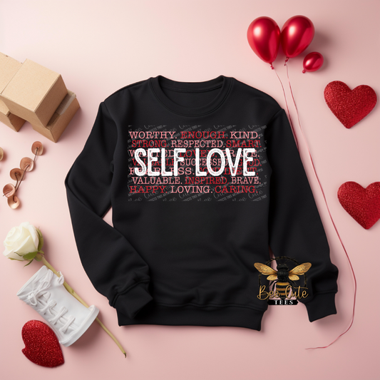 Black sweatshirt with 'SELF LOVE' text on a pink background with decorative elements.