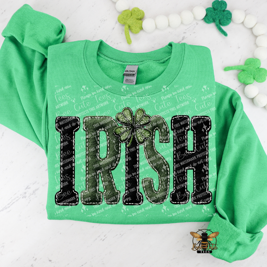 Green sweatshirt with 'Irish' text and shamrock design on a white background