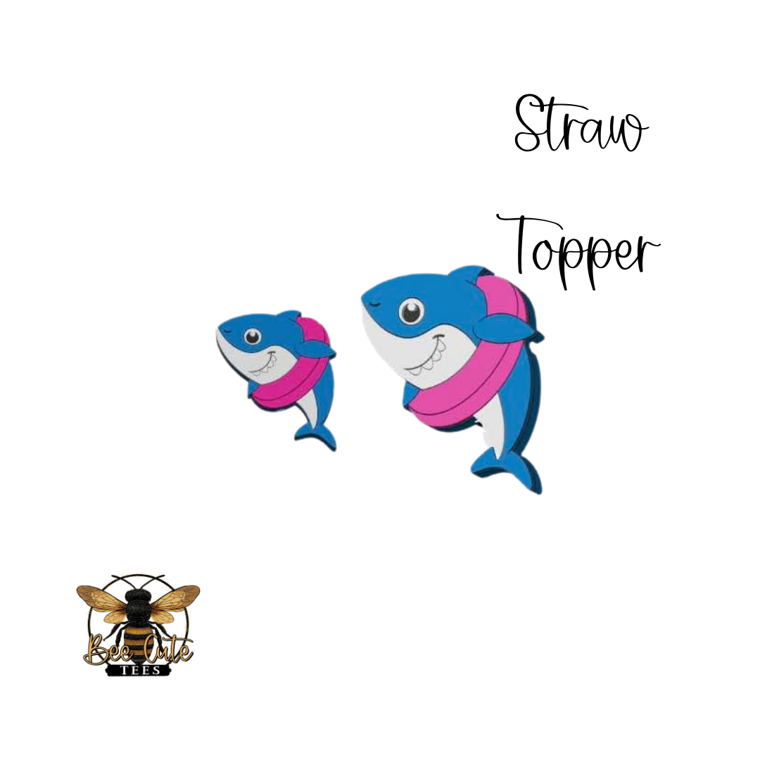 Two cartoon shark designs with a pink inner tube, labeled 'Straw Topper', on a white background.