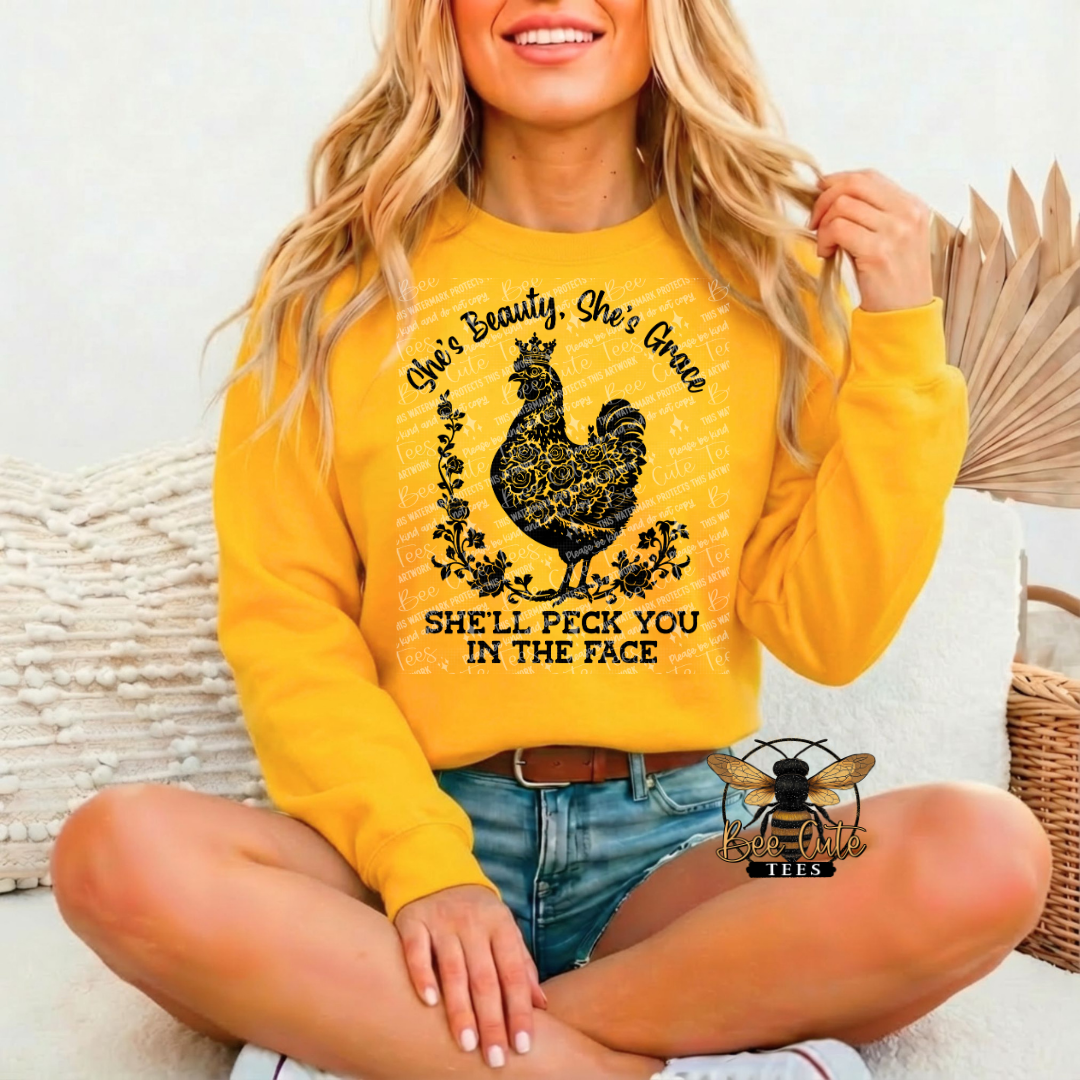 Person wearing a yellow sweatshirt with a graphic design and text.