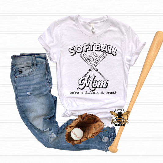 White t-shirt with 'Softball Mom' design, jeans, baseball glove, and bat on a white background