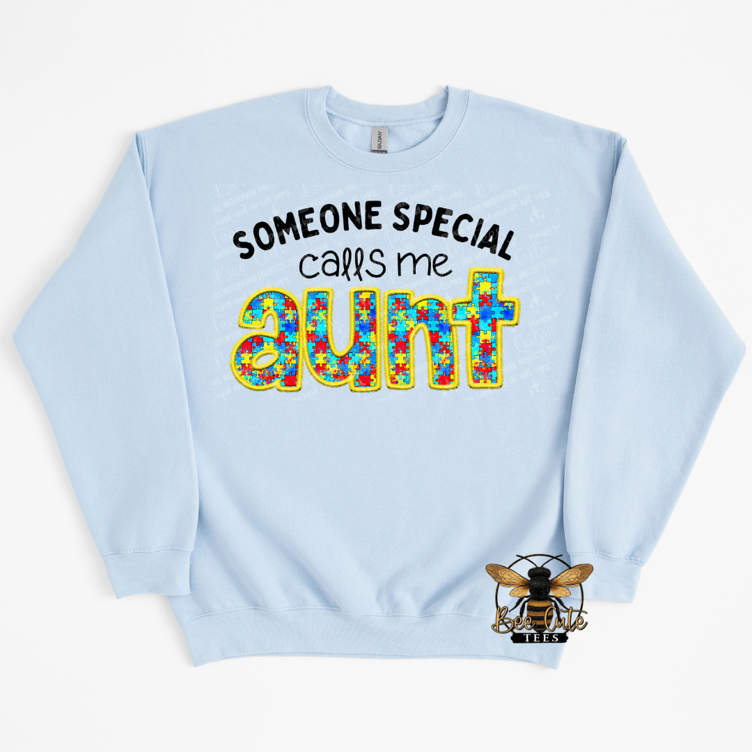 Light blue sweatshirt with colorful text design on a white background