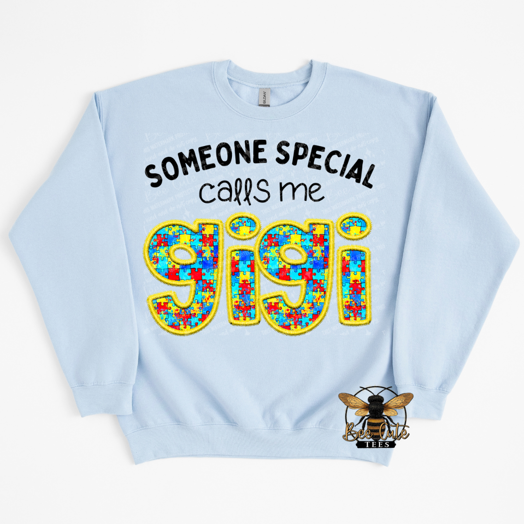 Light blue sweatshirt with colorful 'gigi' text and text 'Someone special calls me gigi' on a white background