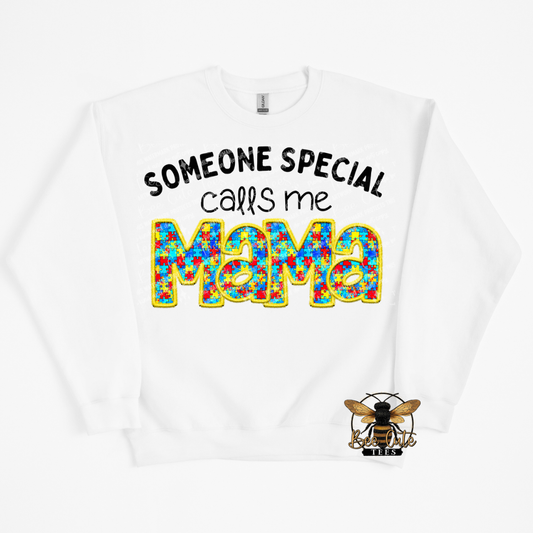 White sweatshirt with colorful 'Mama' text and bee logo on a white background