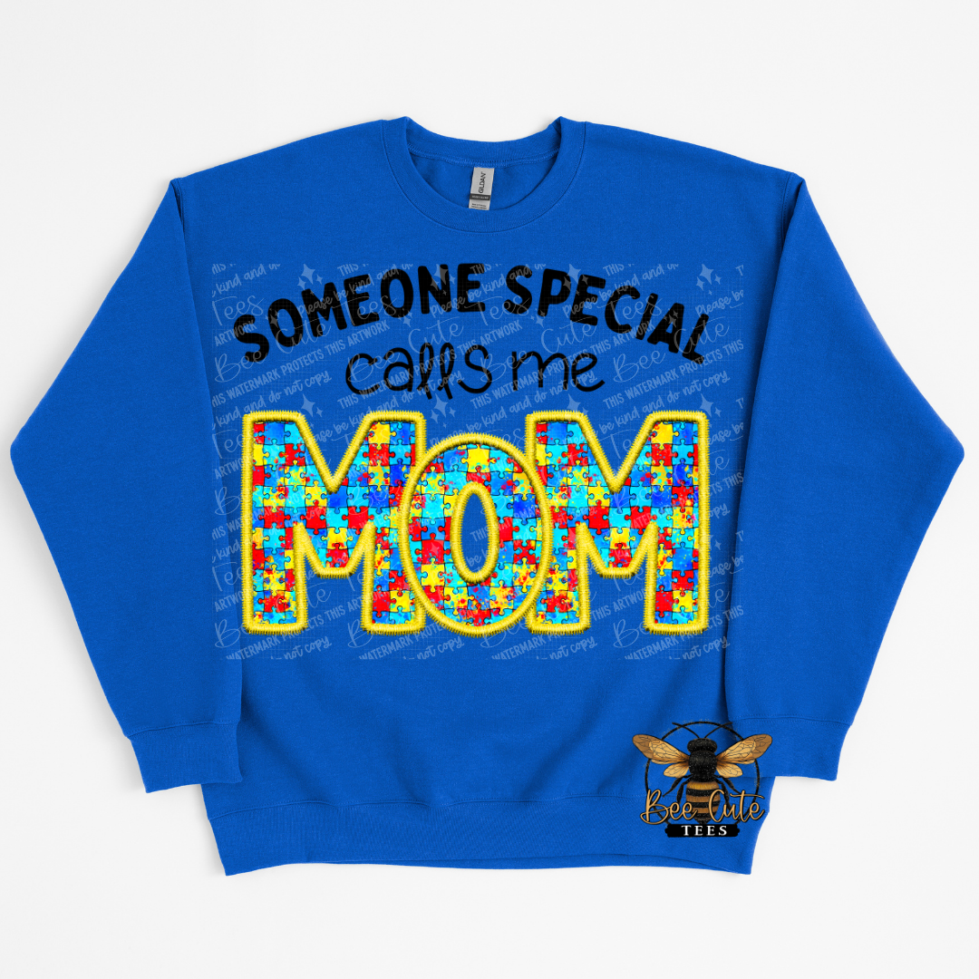 Blue sweatshirt with colorful 'MOM' text and 'Someone Special Calls Me Mom' text on a white background