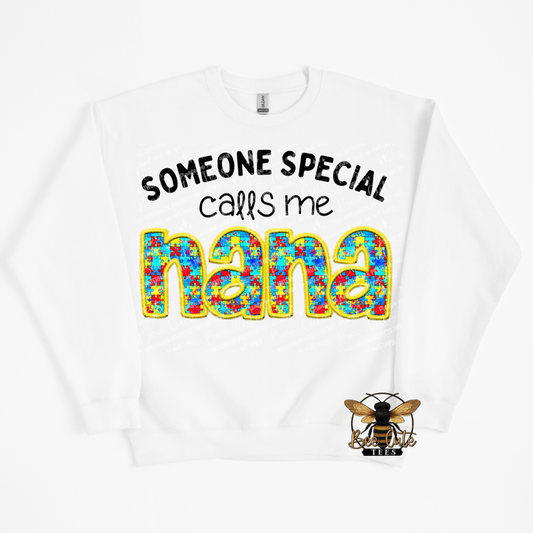 White sweatshirt with colorful text 'Someone special calls me nana' and a bee logo on a white background