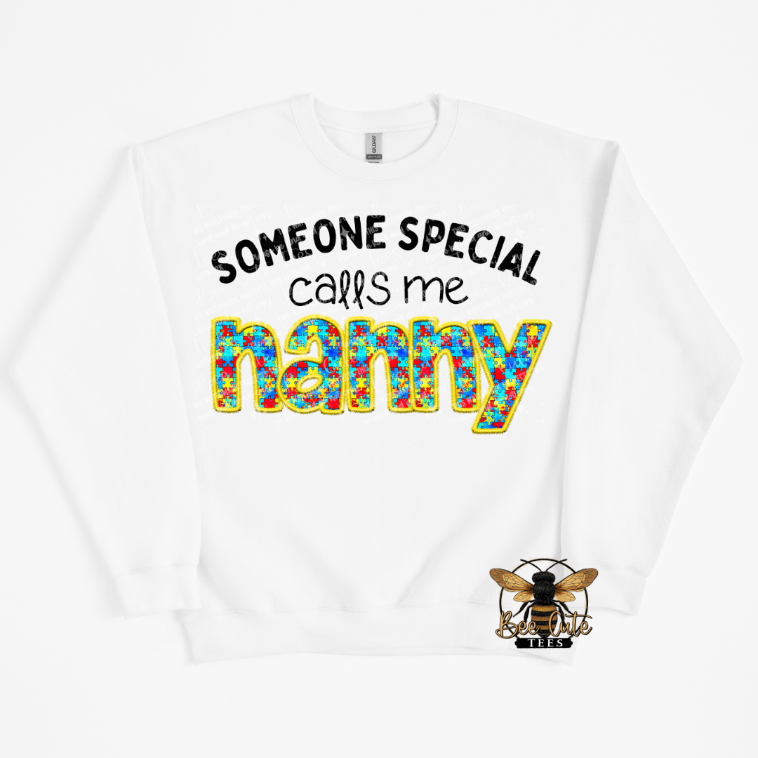 White sweatshirt with colorful text 'Someone special calls me nanny' and a logo on a white background