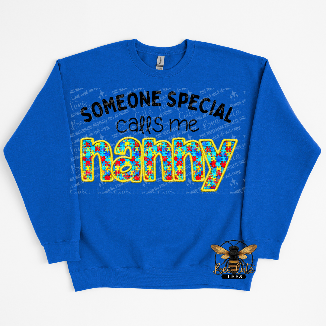 Blue sweatshirt with colorful text 'SOMEONE SPECIAL calls me nanny' on a white background