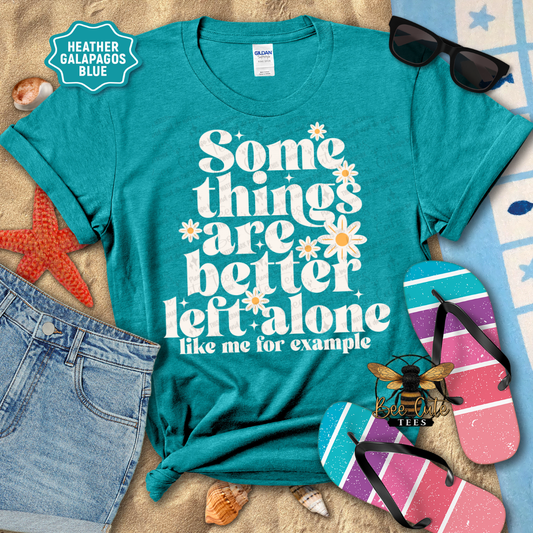 Teal t-shirt with humorous text design on a beach-themed background with sunglasses, flip-flops, and starfish.