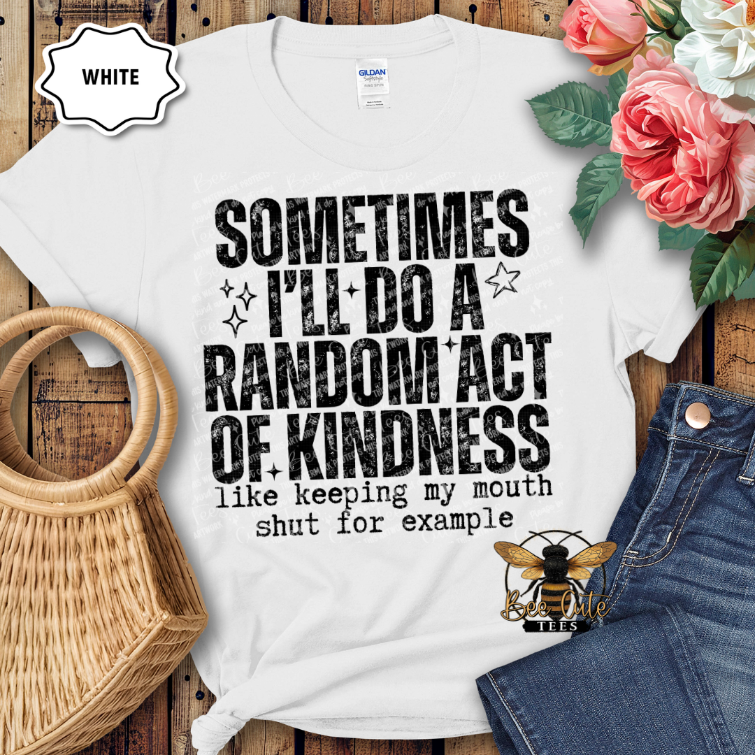 White t-shirt with humorous text design on a wooden surface with flowers and jeans.