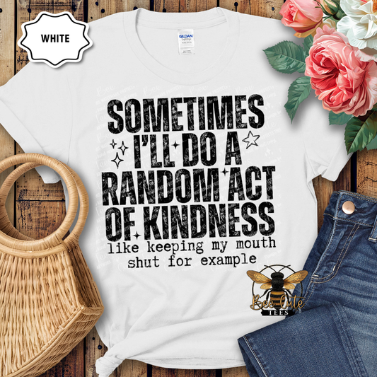 White t-shirt with humorous text design on a wooden surface with flowers and jeans.