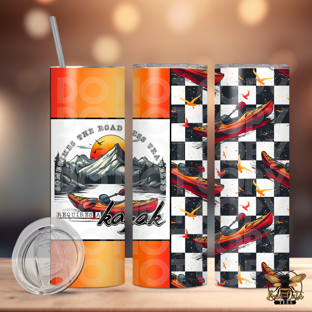Set of three colorful tumblers with unique designs on a wooden surface.