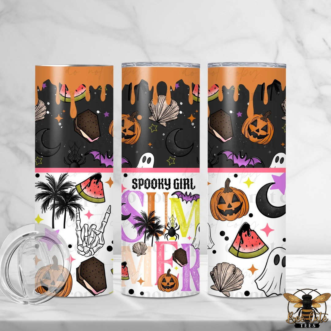 Three insulated tumblers with Halloween-themed wraparound prints are displayed on a white marble surface with a clear lid in the foreground. The designs feature orange pumpkin and watermelon motifs on black and white backgrounds, with the center tumbler reading 'Spooky Girl Summer'.