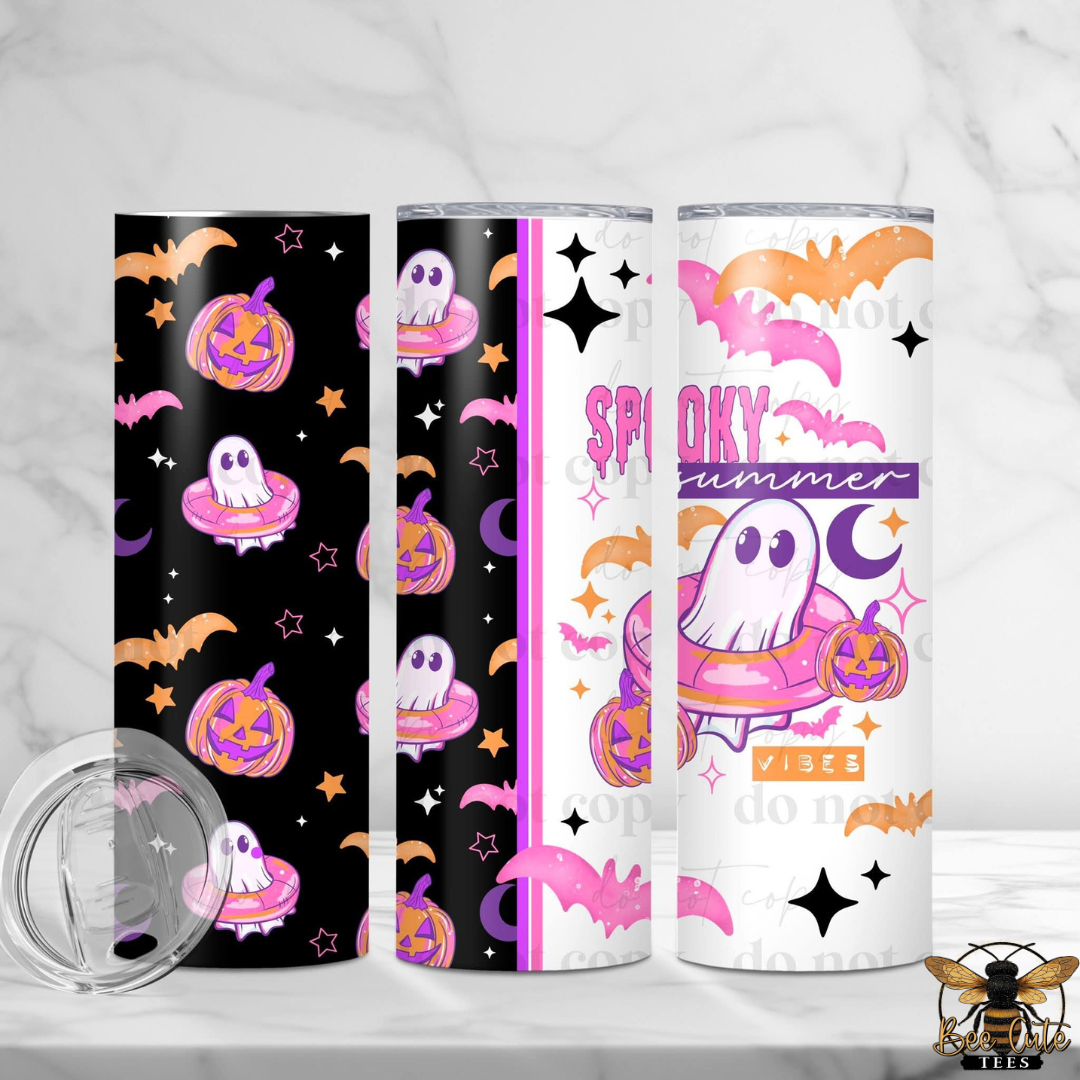 Three Halloween-themed tumbler wrap designs shown on cylindrical tumblers, alongside a clear lid. The designs feature cartoon ghosts, pumpkins, bats, stars, and the words 'Spooky Summer' in pink, purple, orange, black, and white on a light marble background.