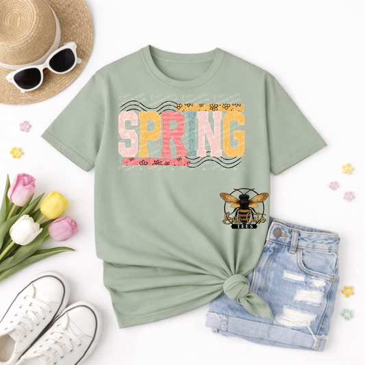 Green t-shirt with 'Spring' design, sunglasses, hat, tulips, and shorts on a white background