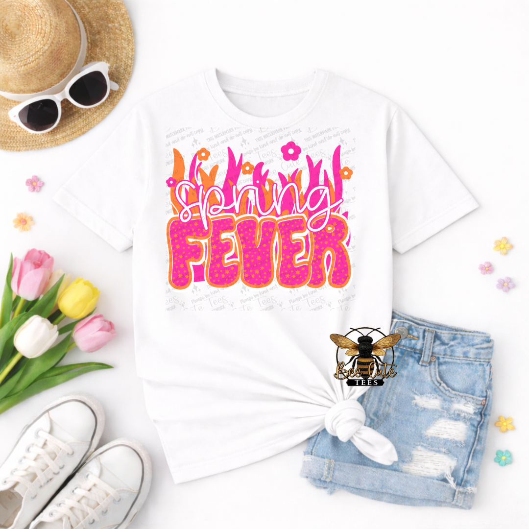 White t-shirt with 'Spring Fever' design, sunglasses, hat, shoes, and flowers on a white background