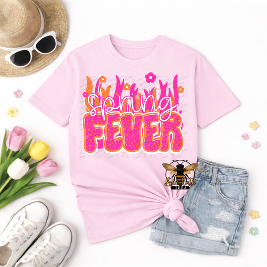 Pink t-shirt with 'Spring Fever' text, sunglasses, tulips, and denim shorts on a white background
