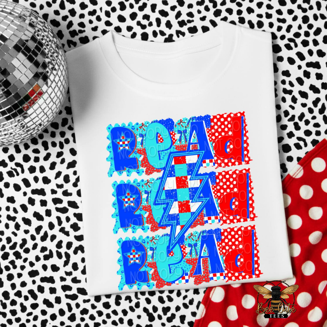 White t-shirt with colorful graphic design on a patterned surface