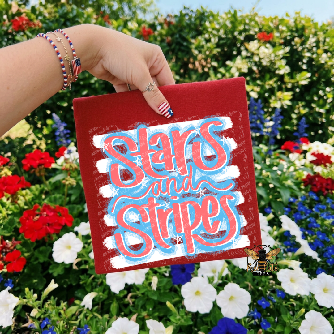 Hand holding a red logo with 'Stars and Stripes' text against a floral background