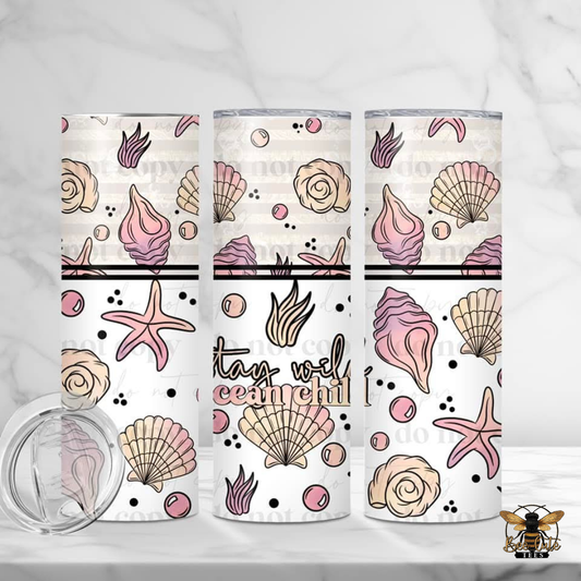 Three tumblers with seashell and starfish designs on a white background