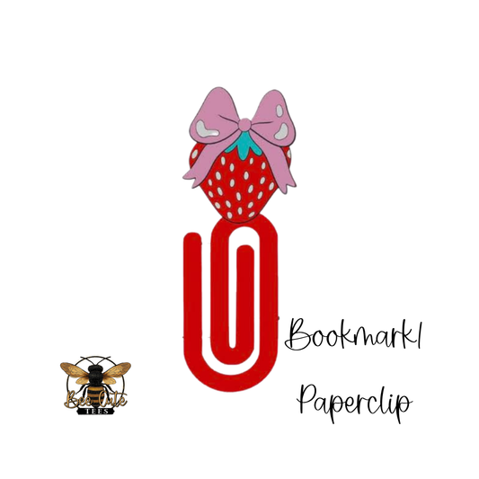 Red paperclip with a strawberry design and pink bow on a white background, labeled 'Bookmark Paperclip'.