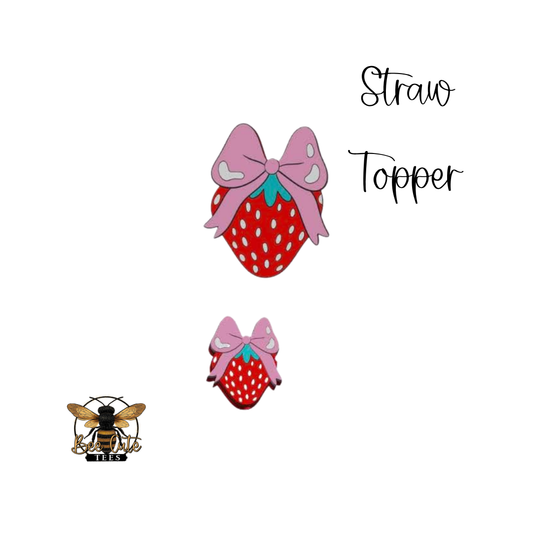 Two strawberry-shaped straw toppers with pink bows on a white background, labeled 'Straw Topper'.