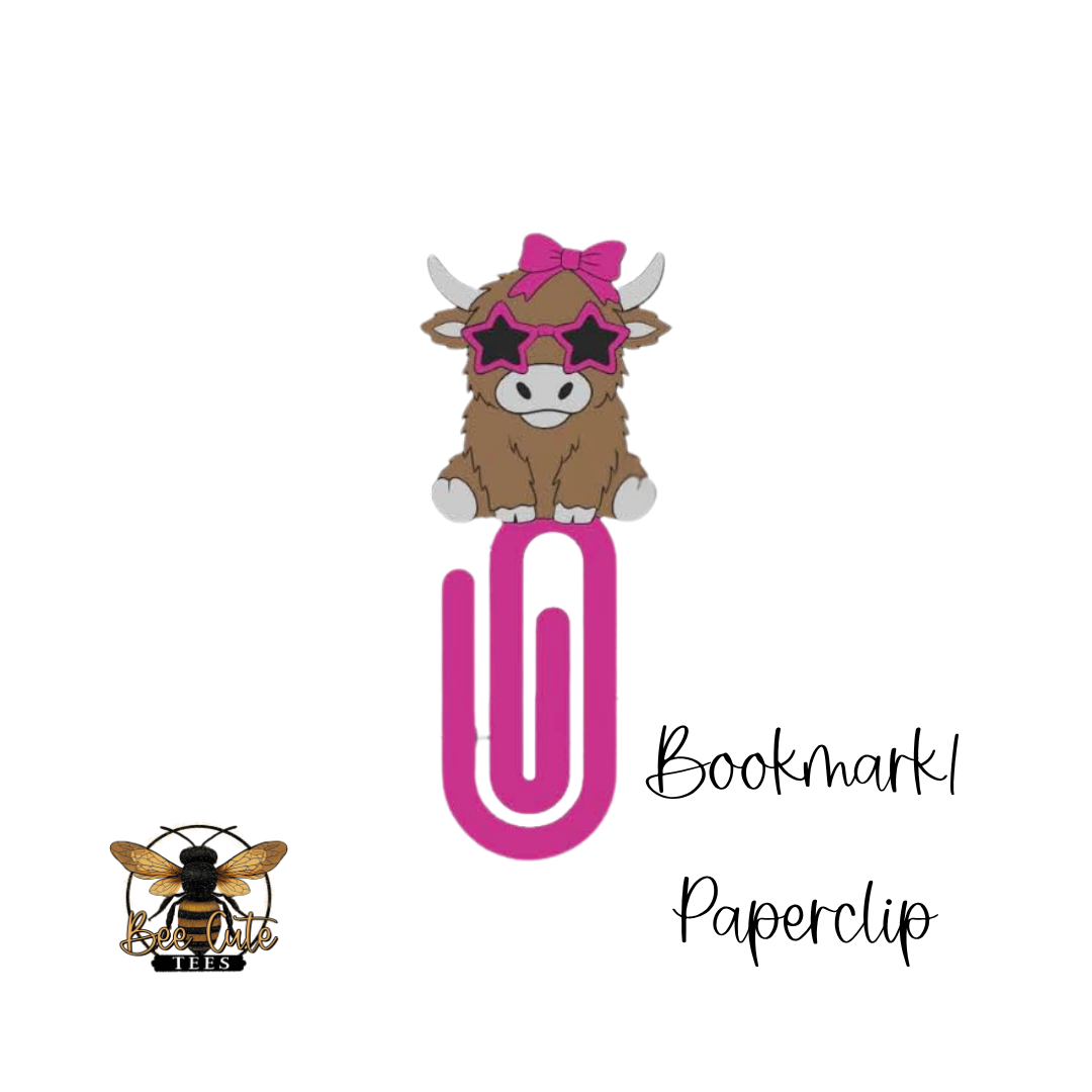 Bookmark paperclip with cow design and sunglasses on a white background