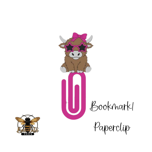 Bookmark paperclip with cow design and sunglasses on a white background