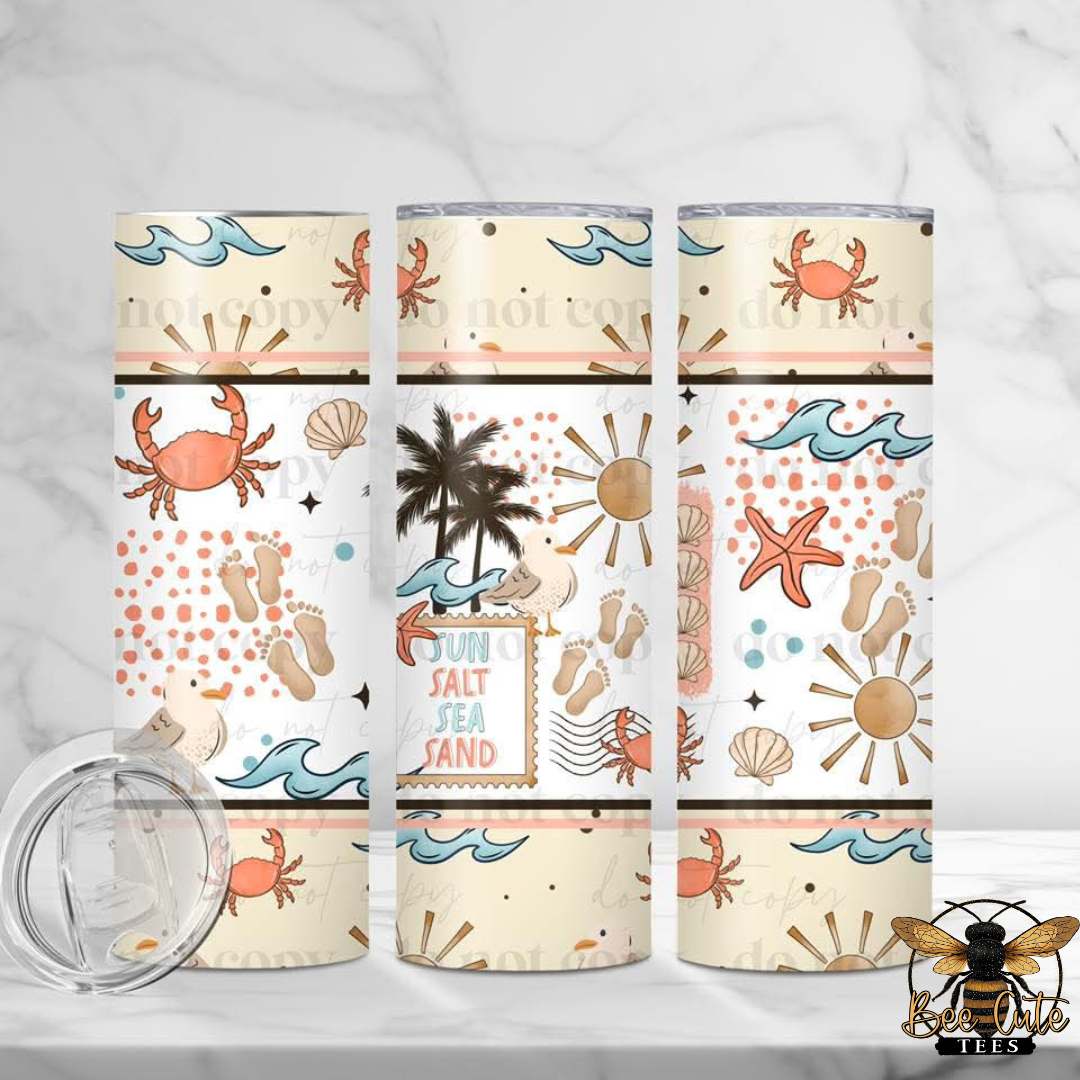 Three tumblers with beach-themed designs on a white background