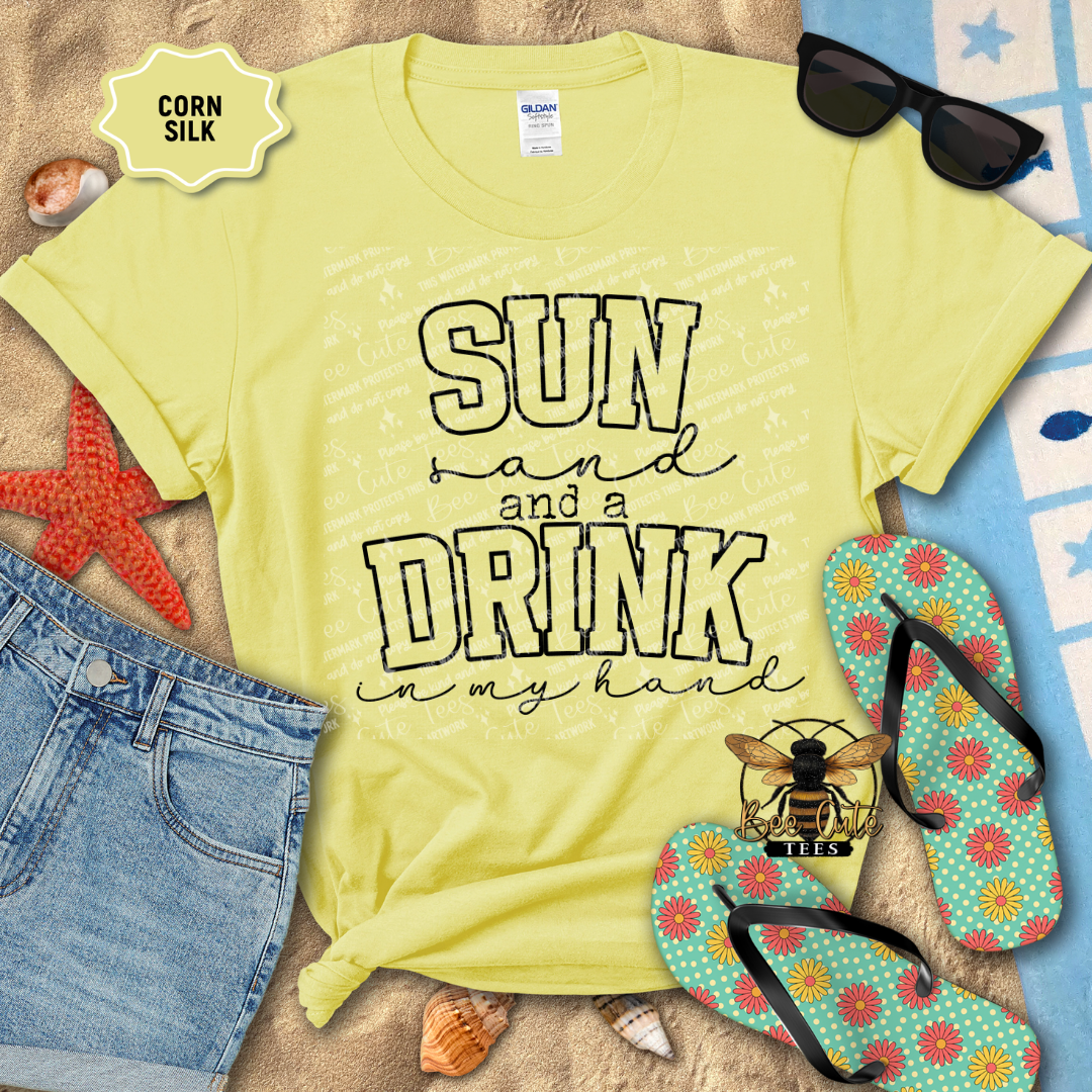 Yellow t-shirt with 'Sun and a Drink in my Hand' text, sunglasses, and flip-flops on a beach-themed background.