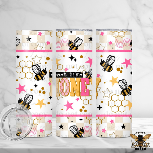 Three tumblers with bee and honeycomb pattern on a white background