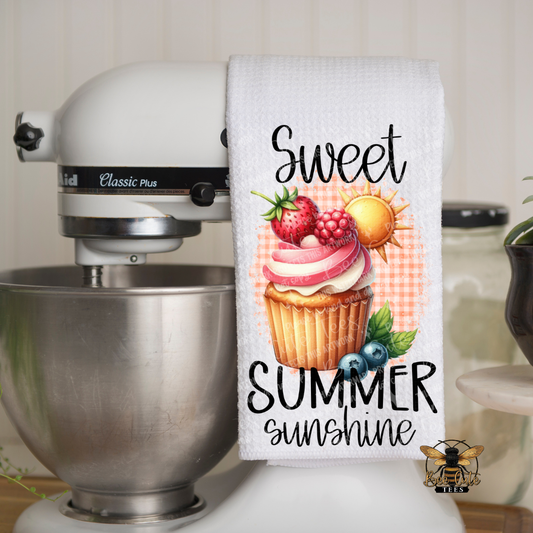 Kitchen towel with 'Sweet Summer Sunshine' design hanging on a mixer