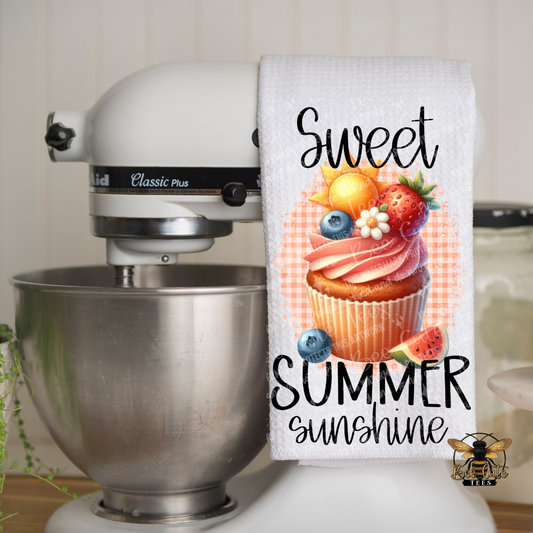 Kitchen towel with 'Sweet Summer Sunshine' design hanging on a mixer.