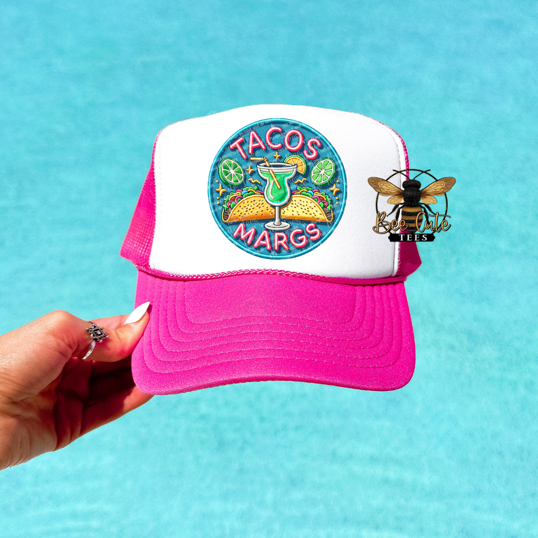 Trucker hat with 'Tacos and Margos' design and bee emblem against a blue background