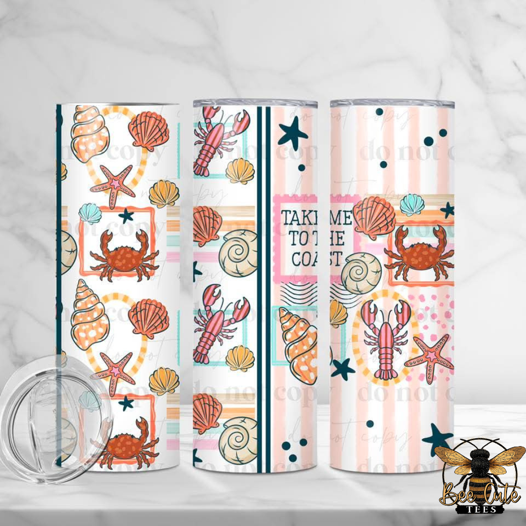 Set of three tumblers with beach-themed designs on a white background
