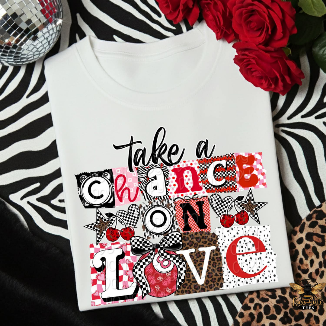 White t-shirt with colorful text design on a zebra print background with flowers and disco ball.
